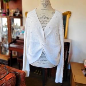 Soft and fuzzy cropped sweater with pearls.